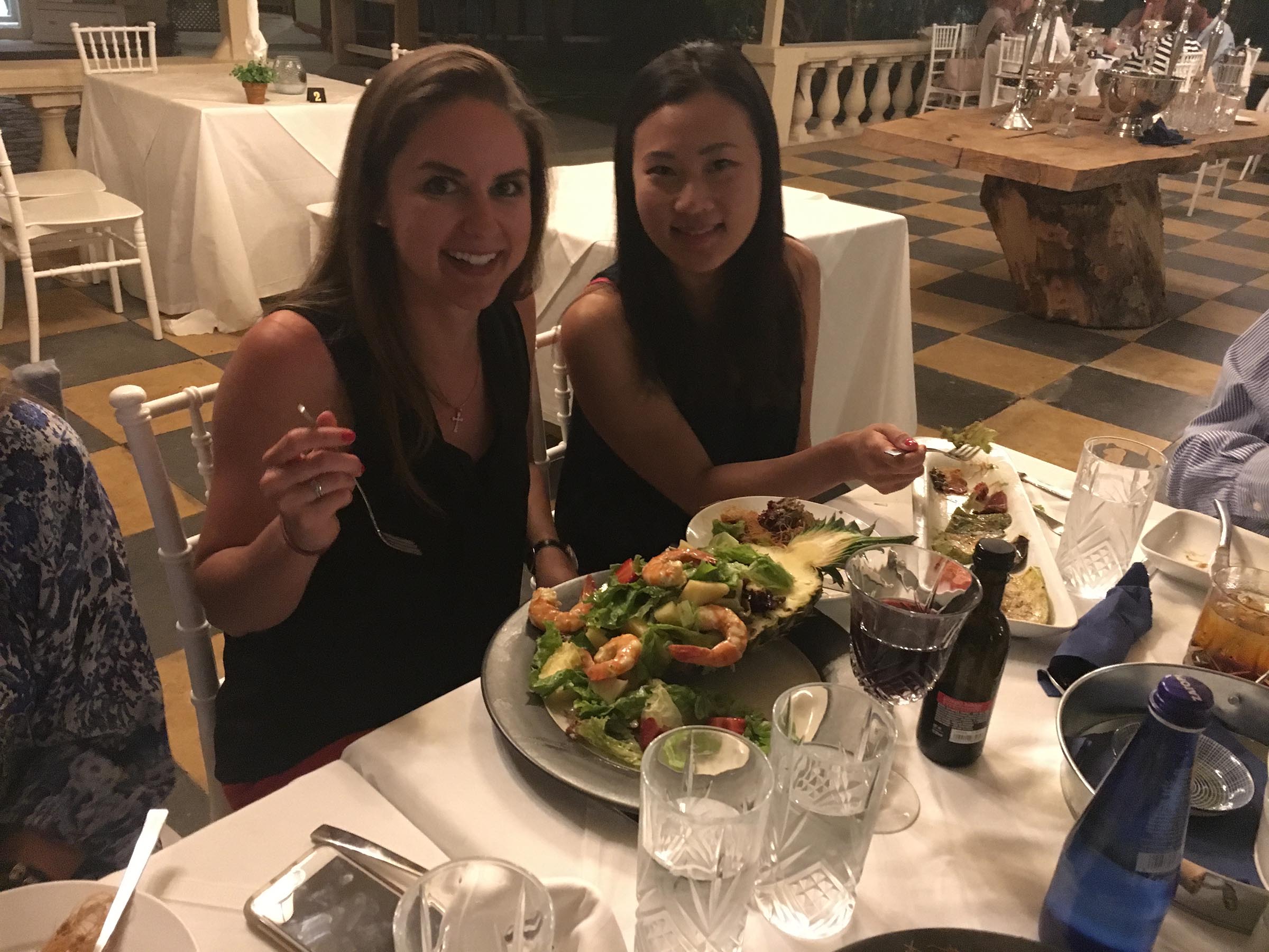 UM Dental Students Kathy Cho and Amanda Robertson enjoying dinner with the group in a Corfu Restaurant